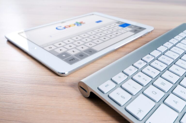 Laptop screen showing Google search results with SEO ranking graph for small business website
